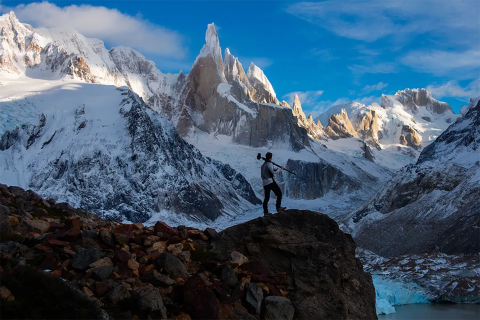 Alex DeMets with his tripod in front of Cerro Torre, Patagonia